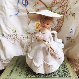 Vintage Rubens girl with white dress, dove, and umbrella planter/vase.